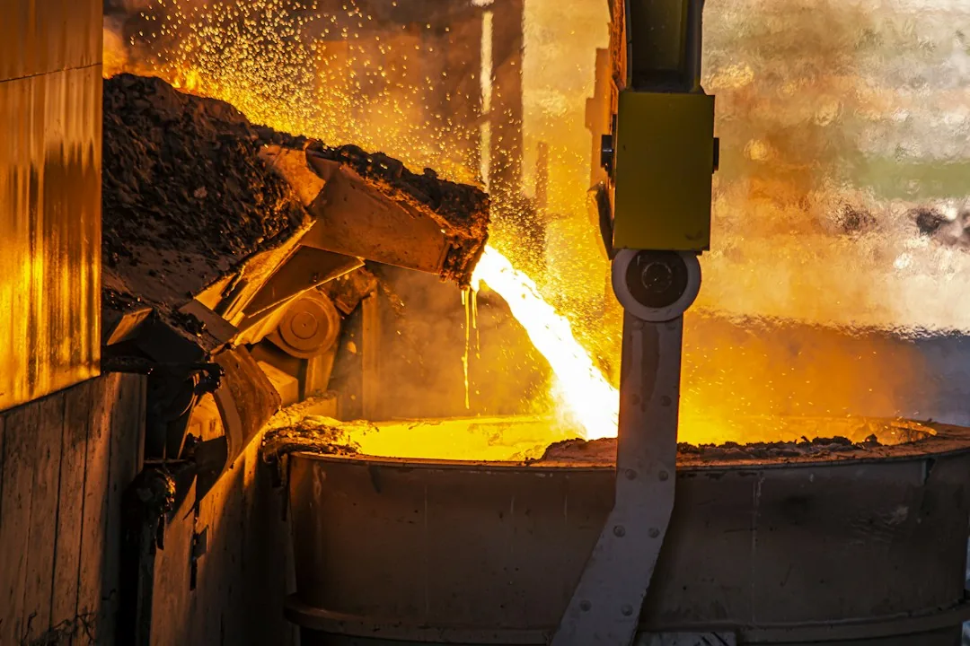 Molten metal poured into a ladle at a smelter